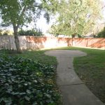 Cascade Apartments exterior walkway with lush landscaping